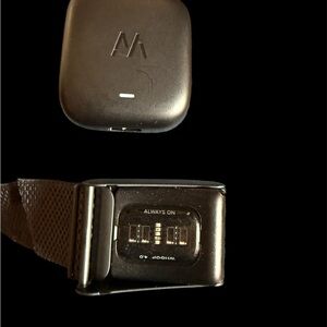 WHOOP 4.0 fitness tracker alongside its companion Battery Pack 4.0.